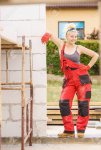 129679696-happy-blonde-woman-wearing-dungarees-about-to-do-some-work-on-construction-site-wome...jpg